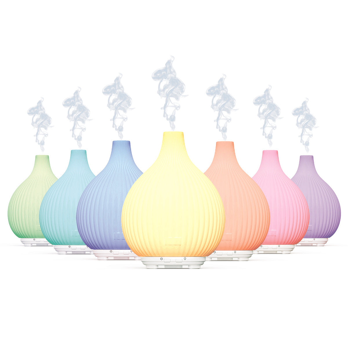 A row of seven LYLA Aroma Diffusers by Rio, each in pastel hues with a ribbed, rounded design, emit streams of white mist—ideal as a humidifier and night-light to refresh and relax any space.