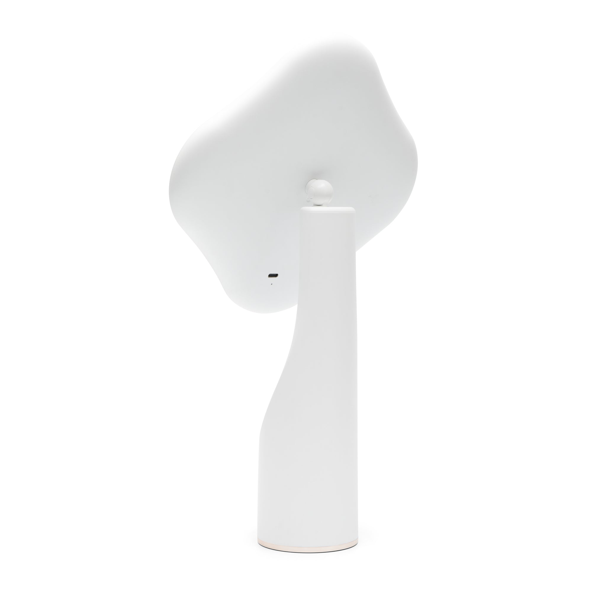 The Rio Illuminated Full Size Beauty Mirror, with a modern minimalist white design and a tall, curved base, is shown from the back on a plain white background. Its flat, irregularly shaped head resembles a cordless beauty mirror.