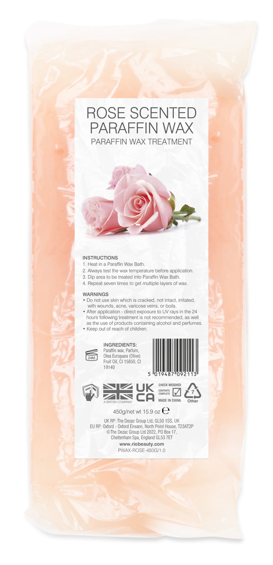 A pink block of Rio Paraffin Wax Rose Fragrance - 450g is packaged clear, labeled for paraffin wax treatment with instructions, warnings, ingredients, and two pink roses above the product name.